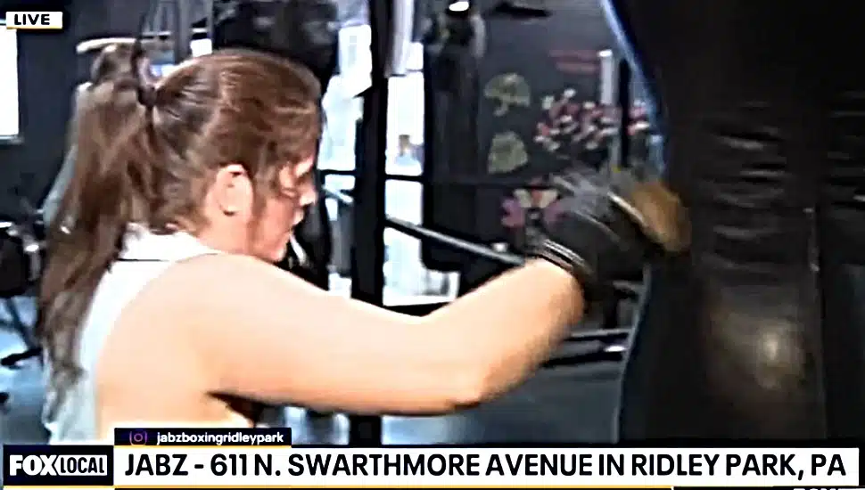 A woman works out with a punching bag at Jabz Boxing in Ridley Park.