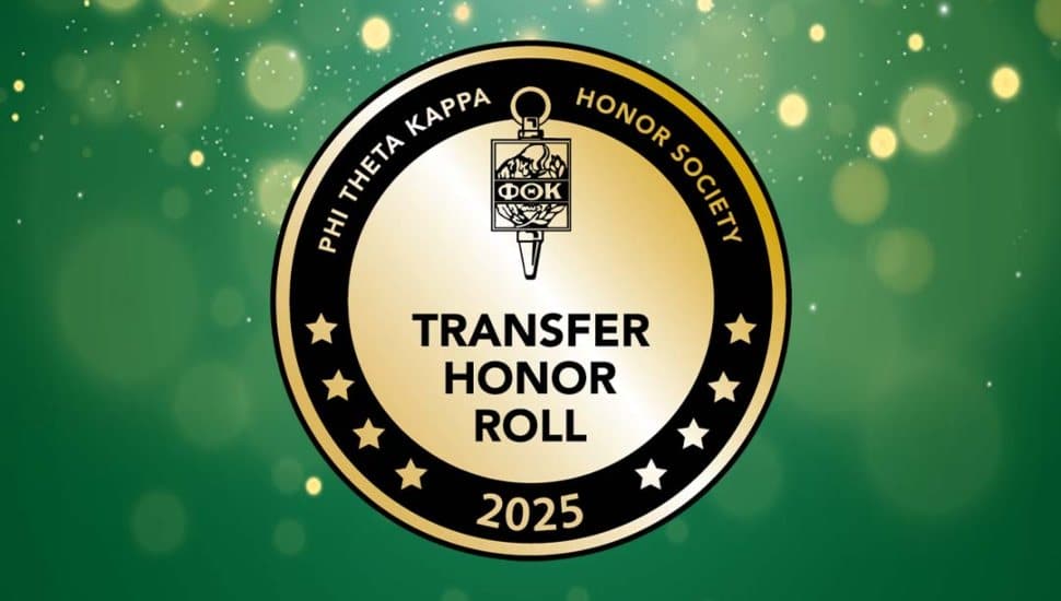 Circular gold and black Phi Theta Kappa Transfer Honor Roll 2025 badge displayed on a green, softly lit background.