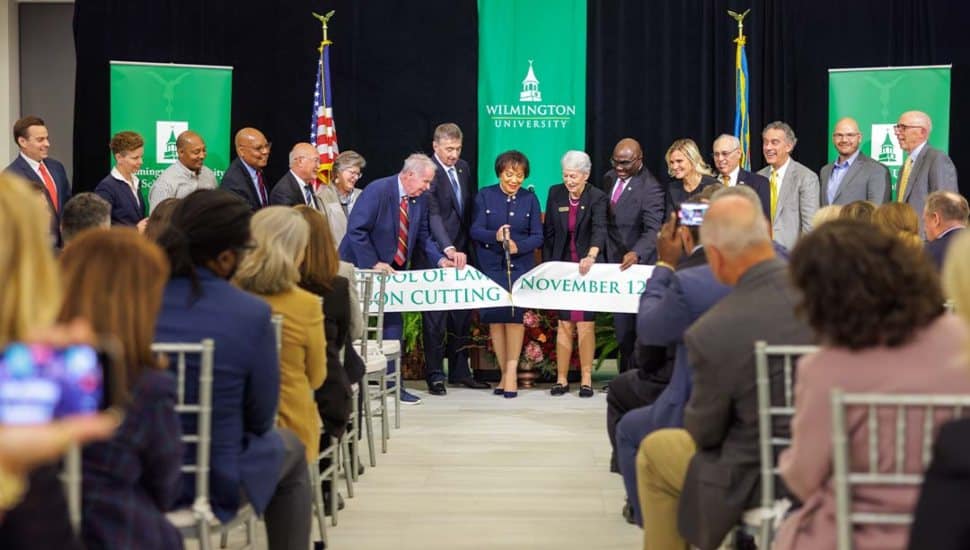 Wilmington University leaders and students cutting ribbon at the opening of the new School of Law facility.