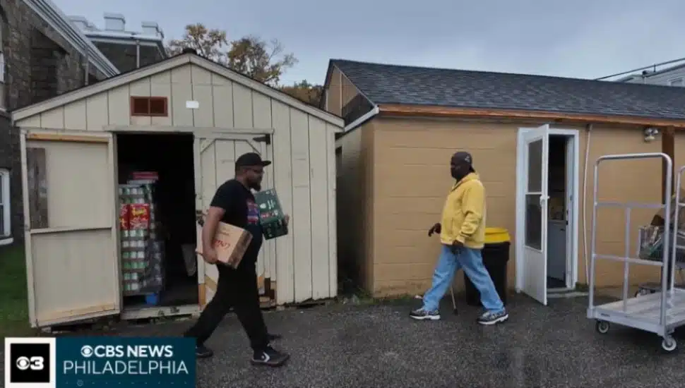 Recipients take food from a food pantry at Mount Zion C.M.E. Church in Sharon Hill.