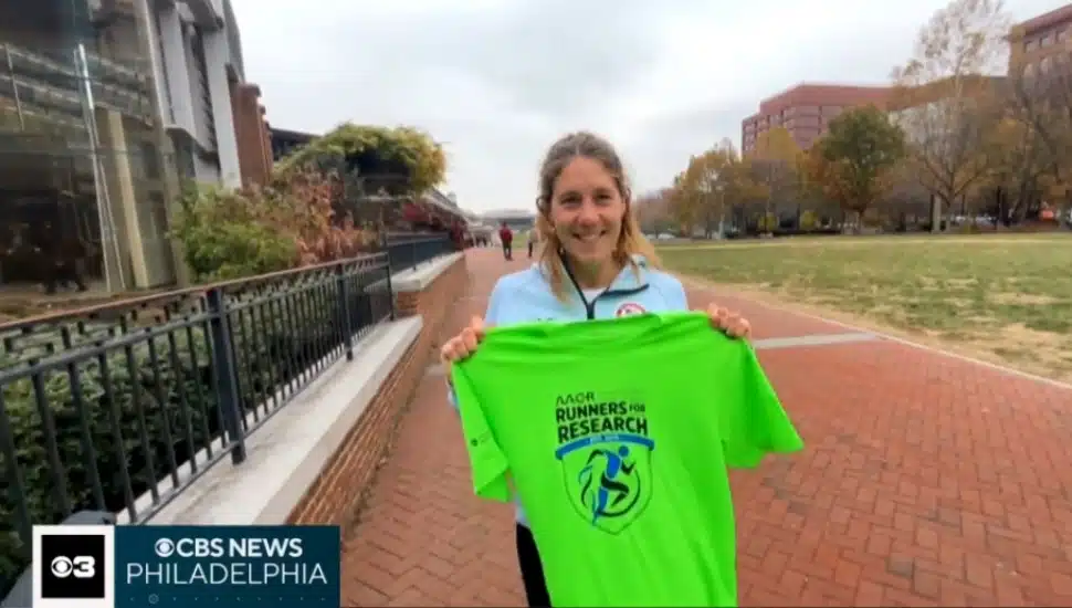 Villanova University field hockey coach Karlie Kisha holds up her Philadelphia Marathon T-shirt.