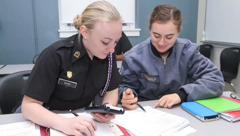 Valley Forge Military Academy and College students study together.