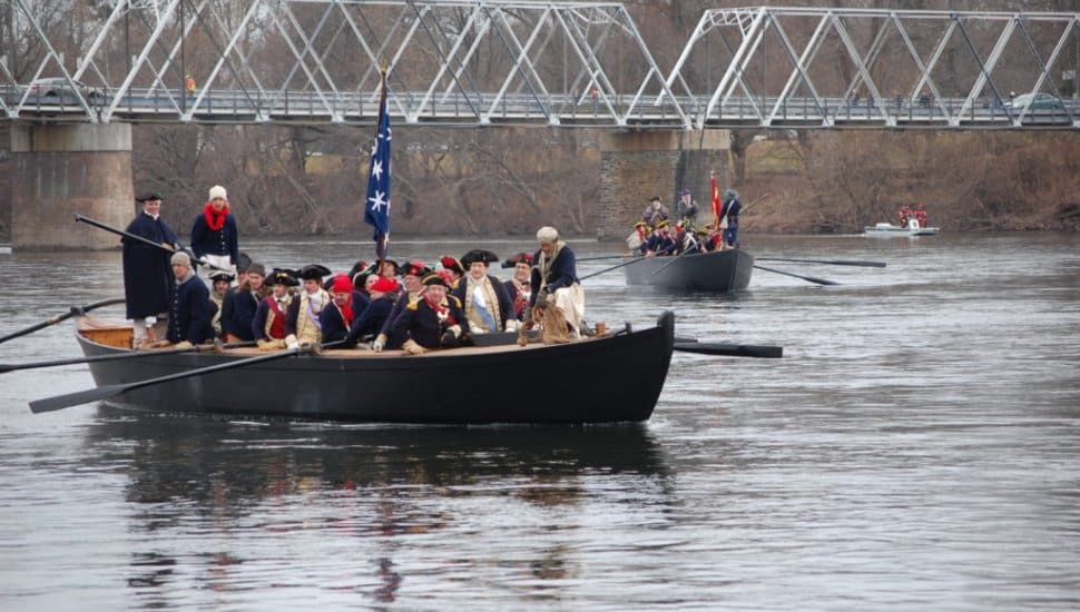 A re enactment of Washington crossing the Delaware.