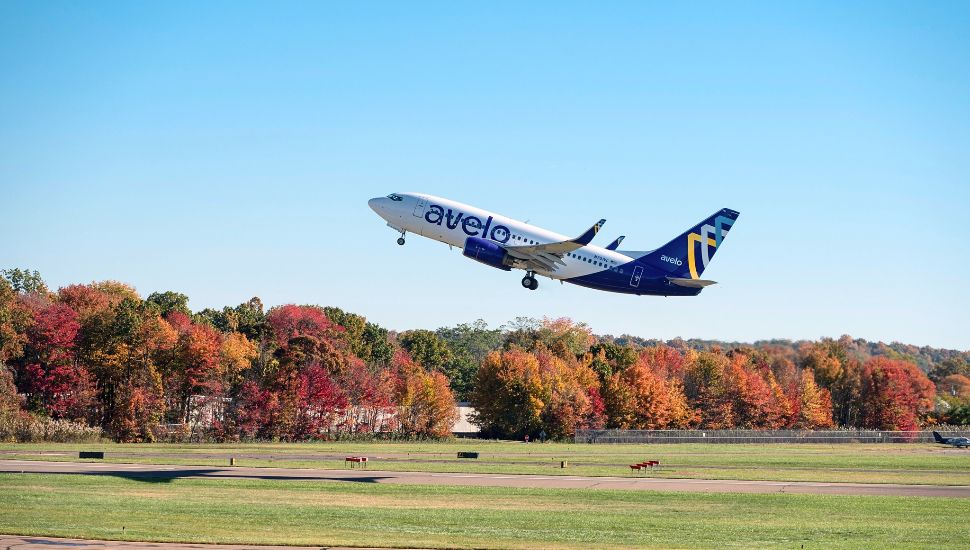An Avelo airplane taking off.