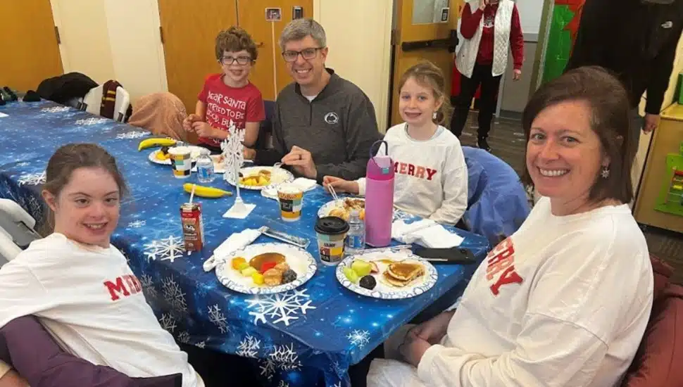 A family enjoys a pancake breakfast at this year’s Holiday Fun Fest at Arc of Chester County.
