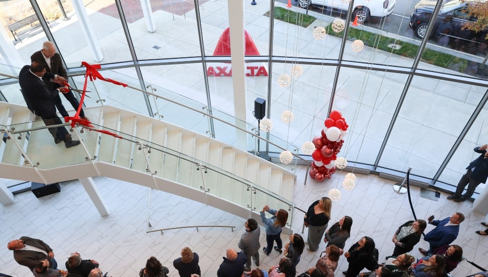 A view from above of people gathered in a group inside a building.