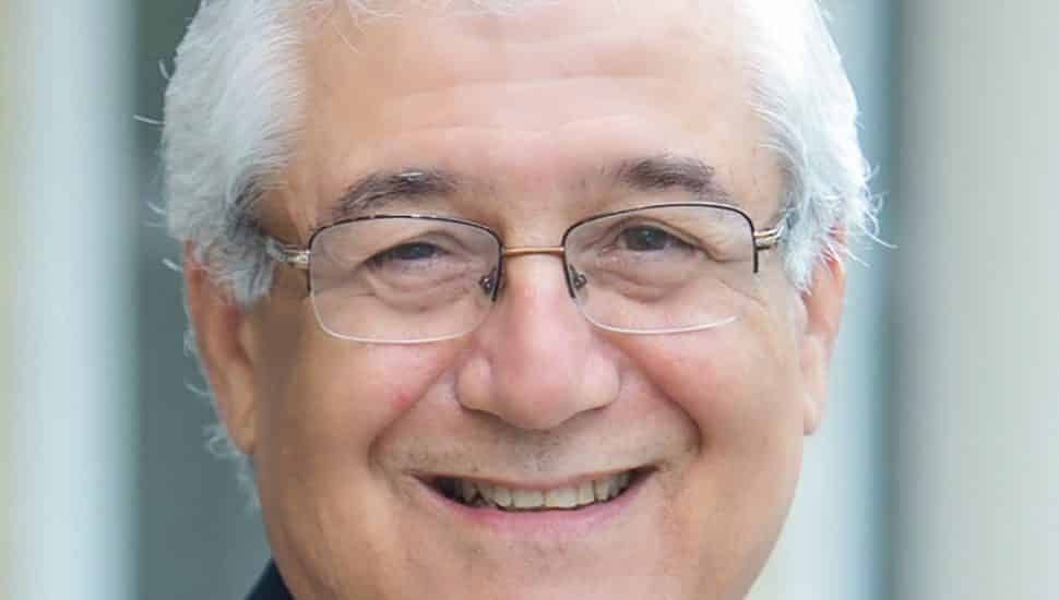 Headshot of nonprofit advisor with white hair and glasses.