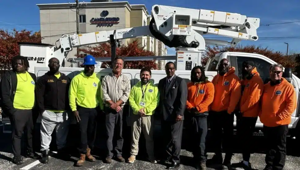 Chester's public works employees gather in front of a new bucket truck.