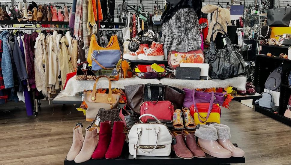 A store filled with clothes at Clothes Mentor.