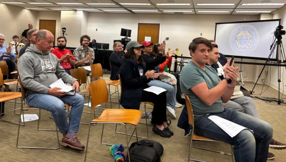Audience members at the September Delaware County Council meeting applaud passage of a resolution creating the Human Relations Commission.