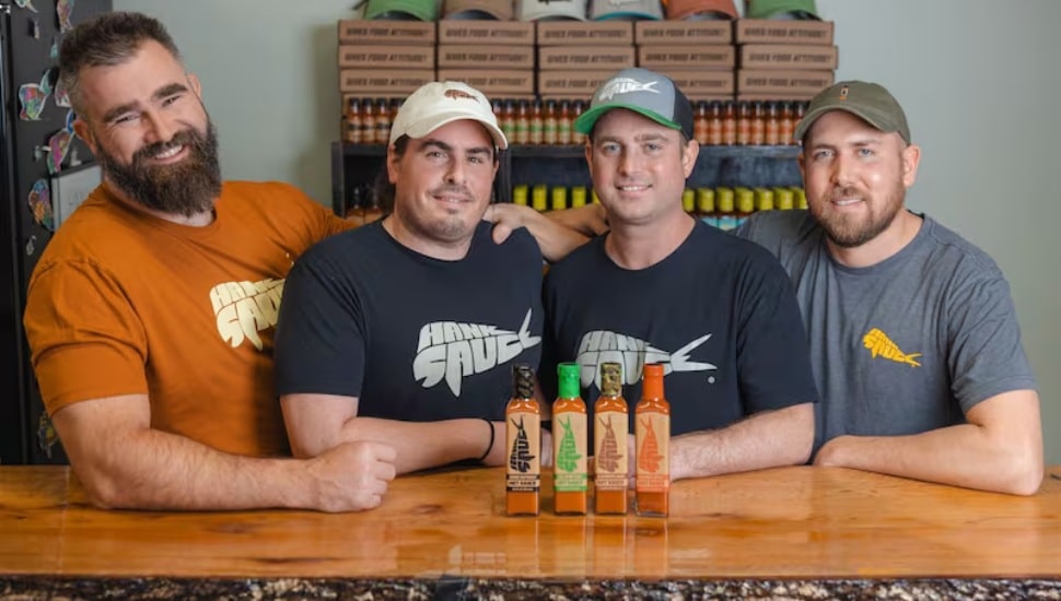 Jason Kelce is pictured with (from left) Hank Sauce co-founders Matt Pittaluga, Brian "Hank" Ruxton, and Josh Jaspan.