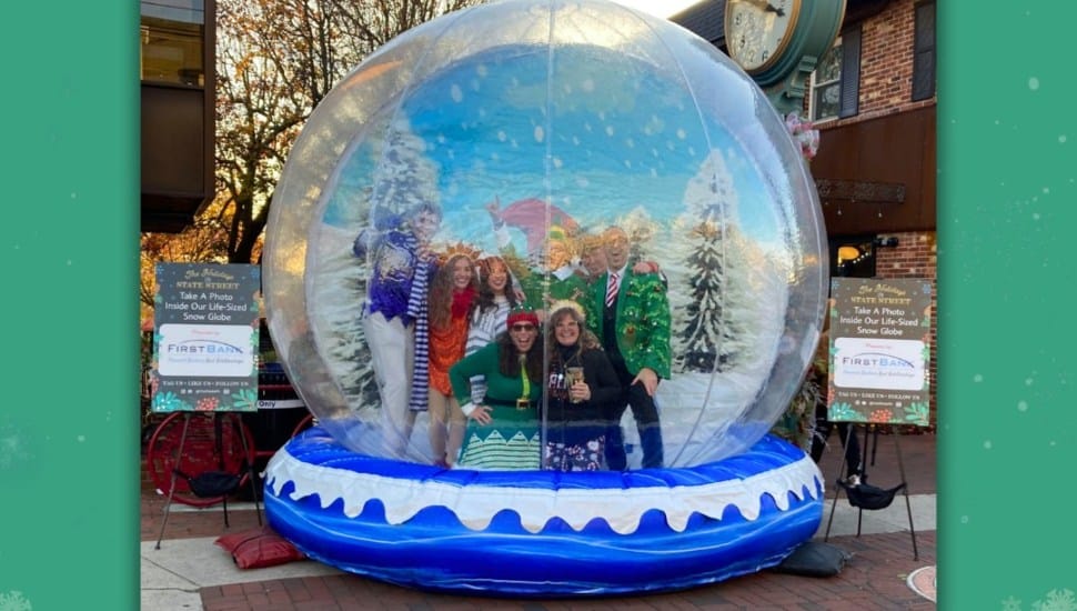 Media Borough encouraged holiday shoppers on State Street in December with several themed activities, including this giant snow globe for photo opportunities, provided by sponsor First Bank.