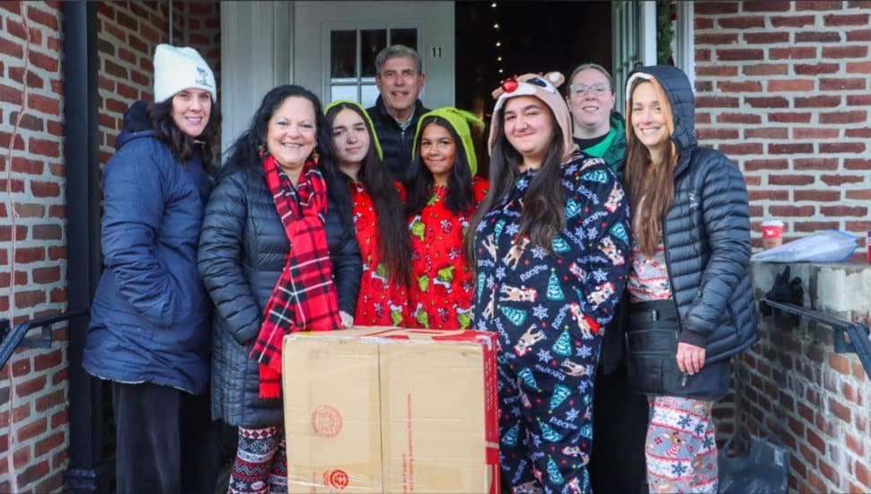 Volunteers with Grands Stepping Up as they collect donated gifts for its holiday gift drive.