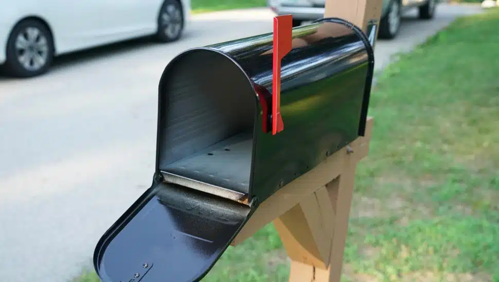A homeowner's mailbox along a street.