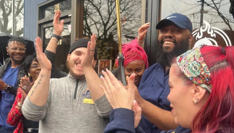 Blue South chef Jacob Blue and manager Louis Feliciano, celebrate with friends at the grand opening of the restaurant at 28 N. Lansdowne Ave.