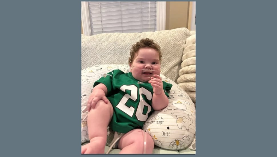 Callan Palladino wearing his Kelly green Saquon Barkley jersey.
