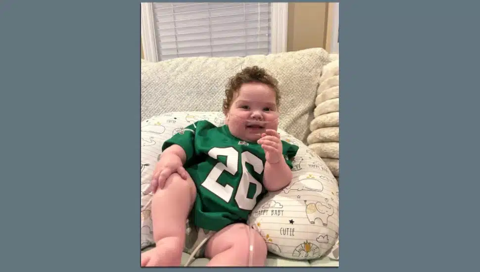 Callan Palladino wearing his Kelly green Saquon Barkley jersey.
