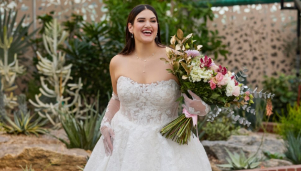 A woman in a wedding gown from David's Bridal.