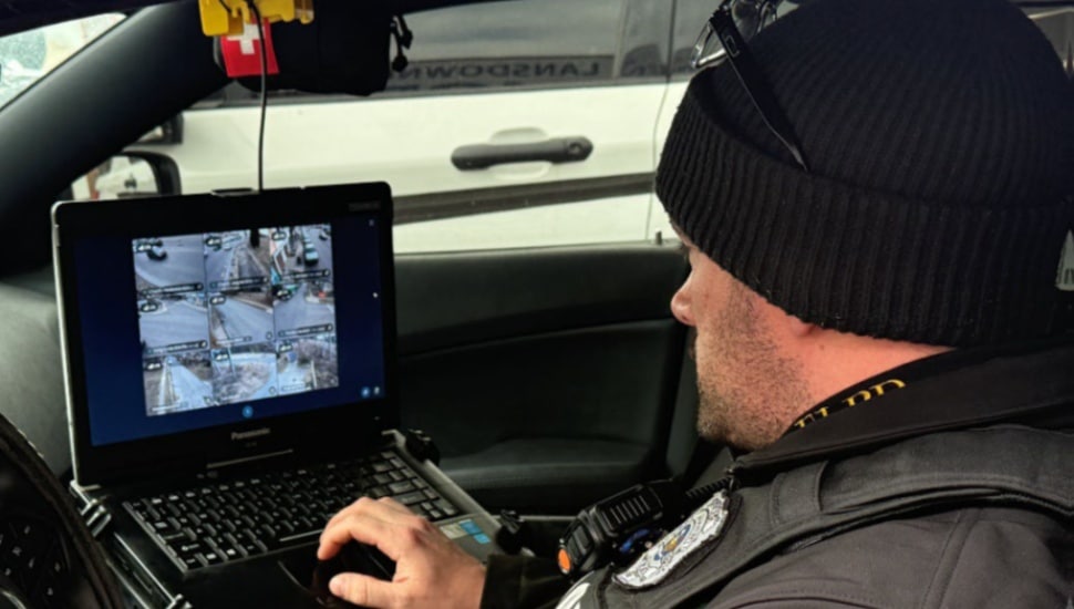 An East Lansdowne police officer monitors public safety cameras in the borough.