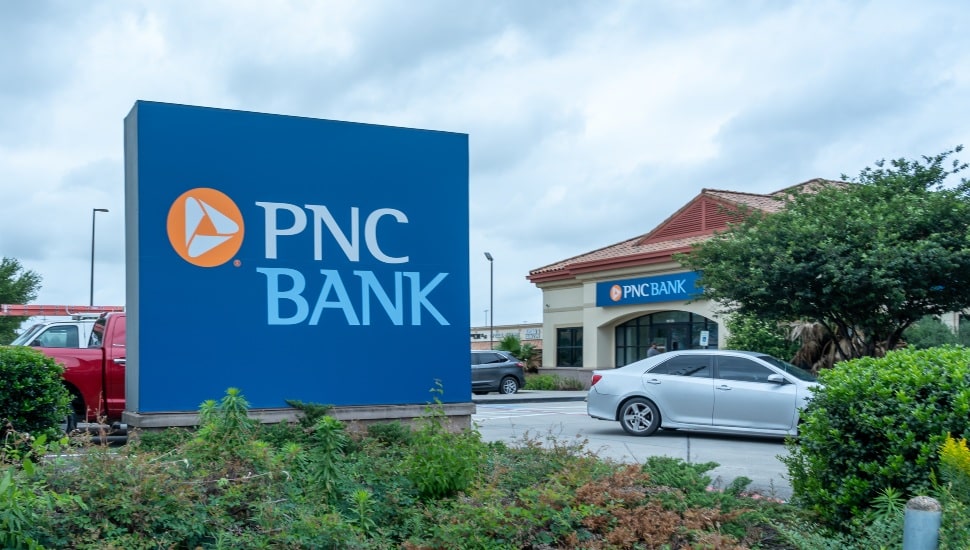 A PNC Bank sign near the parking lot of a PNC Bank.
