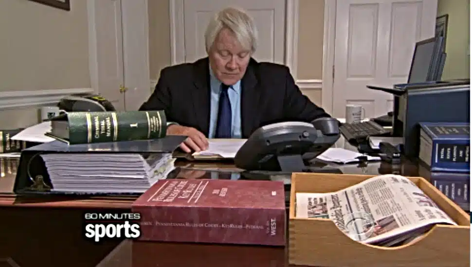 Media prosecutor Joseph McGettigan behind a desk.