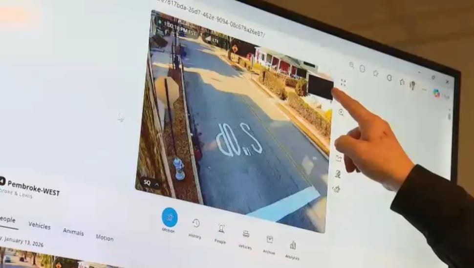 East Lansdowne Police Chief James Cadden points to a black square the AI has placed over a private residence window in surveillance footage.