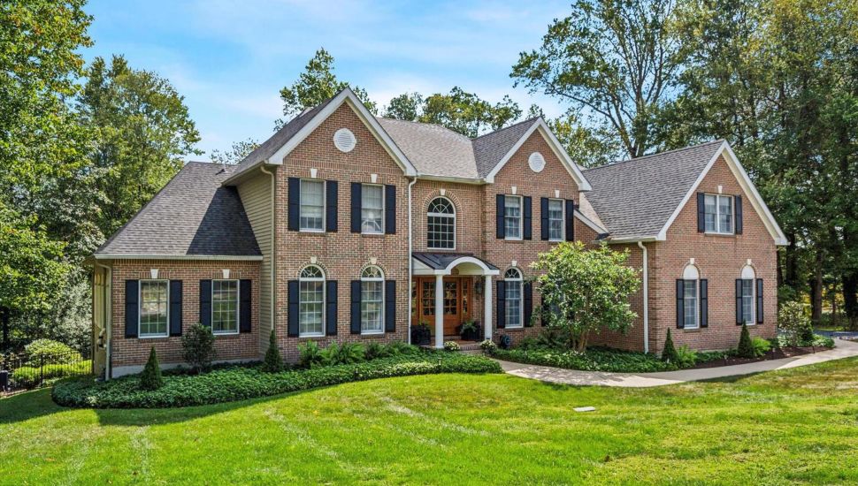 This brick-front Colonial at 20 Kingston Road in Media is for sale.