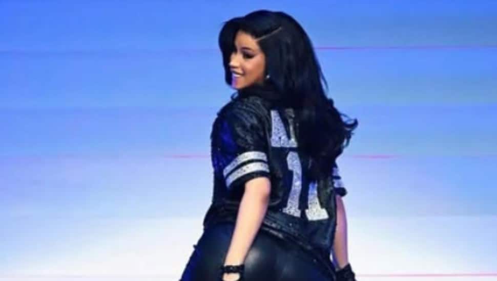 Cardi B dances on stage with her back turned to the audience.