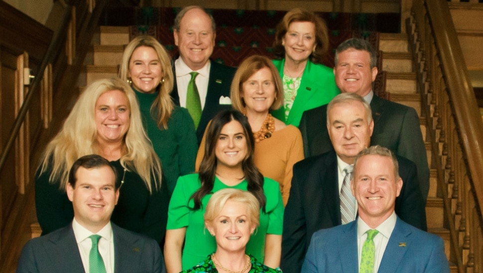 11 people in a group, men and women from the Howard Hanna Real Estate team.