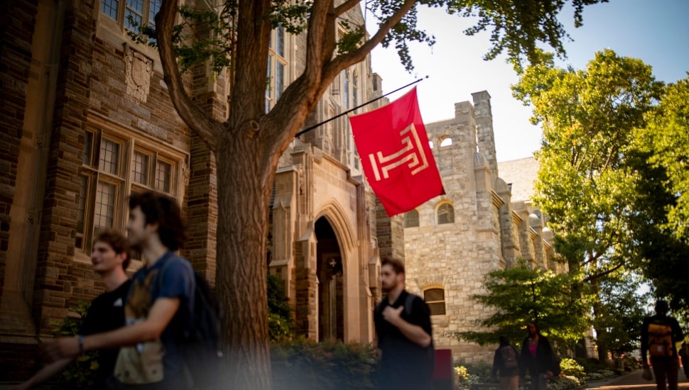 A Temple University building with the Temple flag.