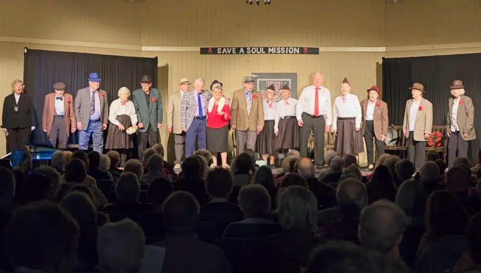 The Freedom Village Players cast of Guys and Dolls SR take a curtain call before an appreciative audience.