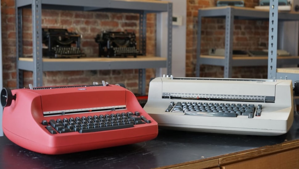 A red and a white IBM Selectric.
