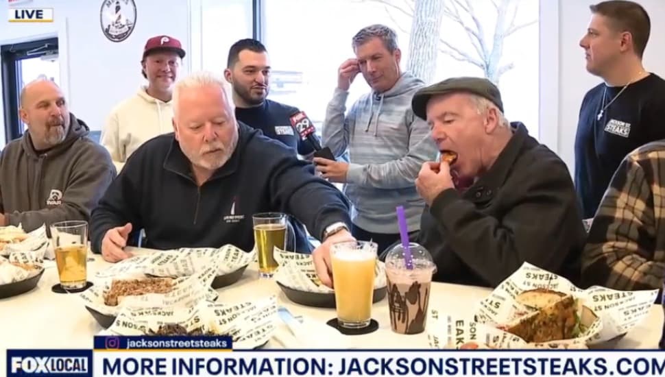 A crowd of customers gather at Jackson Street Steaks & Brewpub in Media. Bob Kelly with Fox 29 is standing with owners Gus and Pete, and Mike Meyers.