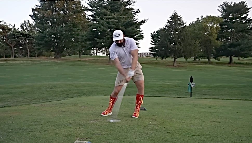 Jason Kelce tests out a pair of golf boots at the McCall Golf Club in Upper Darby.