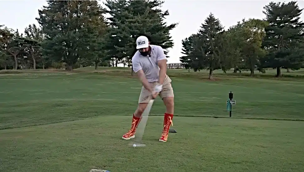 Jason Kelce tests out a pair of golf boots at the McCall Golf Club in Upper Darby.