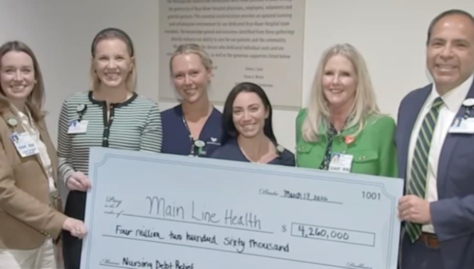 Main Line Health CEO Ed Jimenez and Bryn Mawr nurses accept anonymous donation.