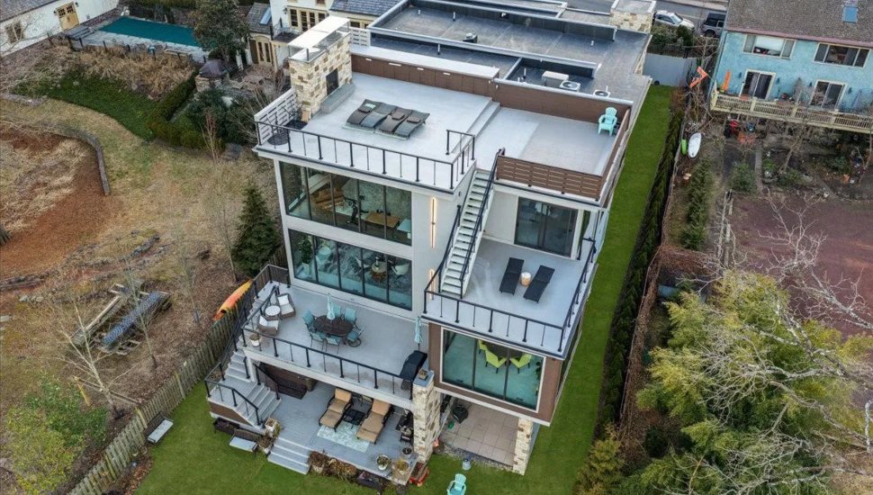 New Hope Waterfront Home with five terraces and expansive windows.