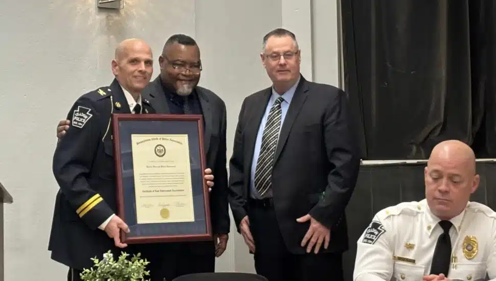 Celebrating the Yeadon police department’s newly earned state accreditation are, (from left), borough Police Chief Henry Giammarco with the certification, Yeadon Mayor Rohan Hepkins and Nether Providence Police Chief David Splain, who represented the certifying agency, PLEAC.