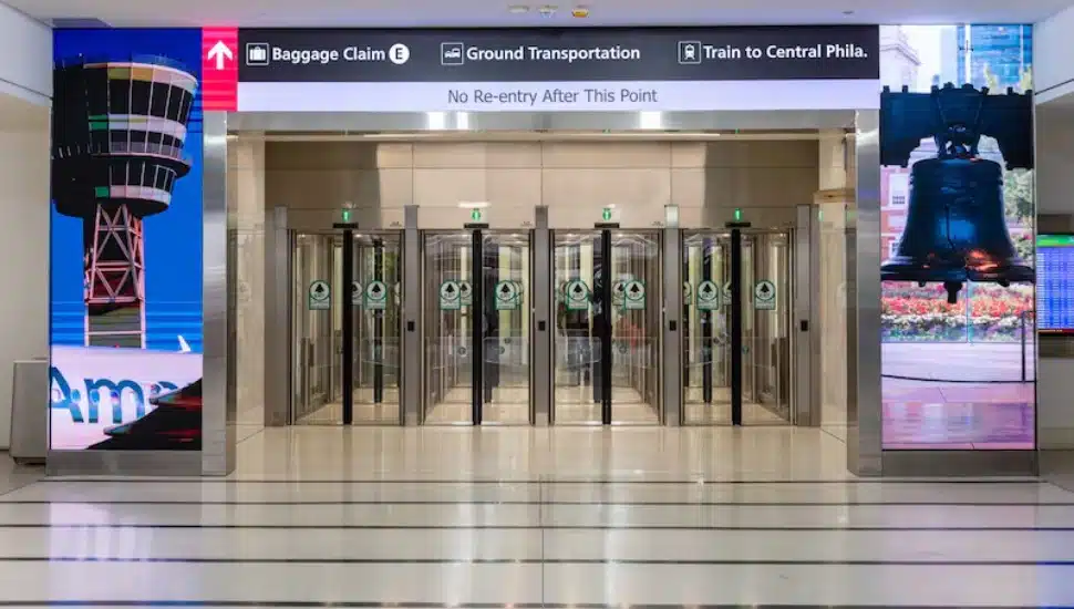 New exit lanes in Terminal E. Philadelphia International Airport is adding new terminal exit lanes with modern glass corridors and doors.