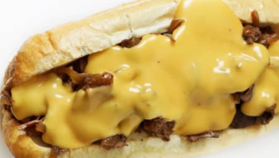 A cheesesteak with lots of cheese.