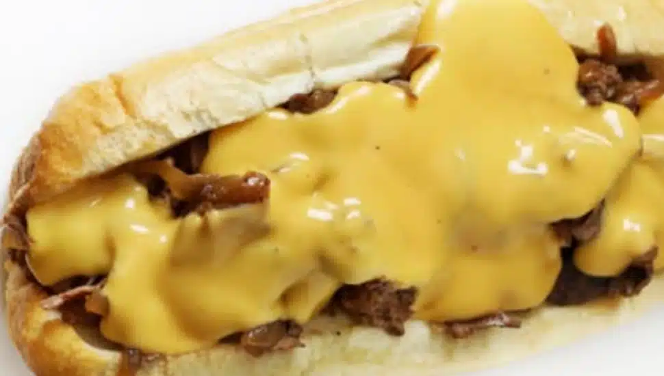 A cheesesteak with lots of cheese.