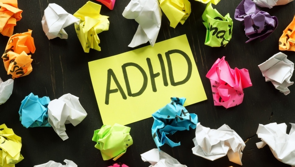 Crumpled up post-it notes around an ADHD note.