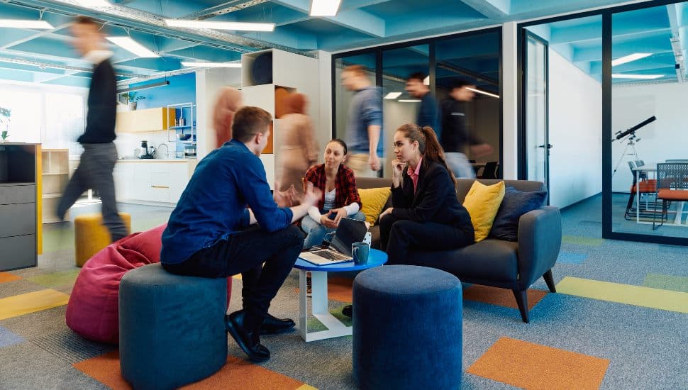 People in a small group discussing business.