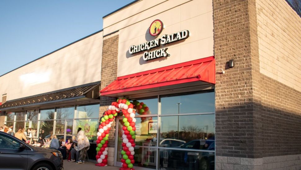 Chicken Salad Chick restaurant with balloons outside.