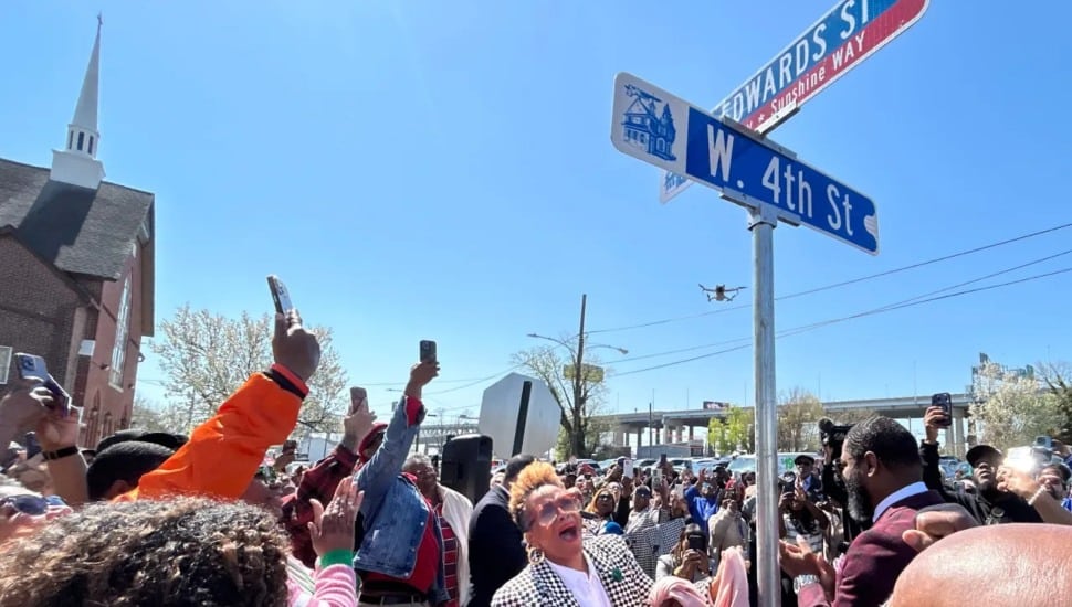 Grammy winner Denise Nicole White, known professionally as Avery*Sunshine, reacts to a street sign honoring her as the city also proclaimed Friday Avery*Sunshine Day.
