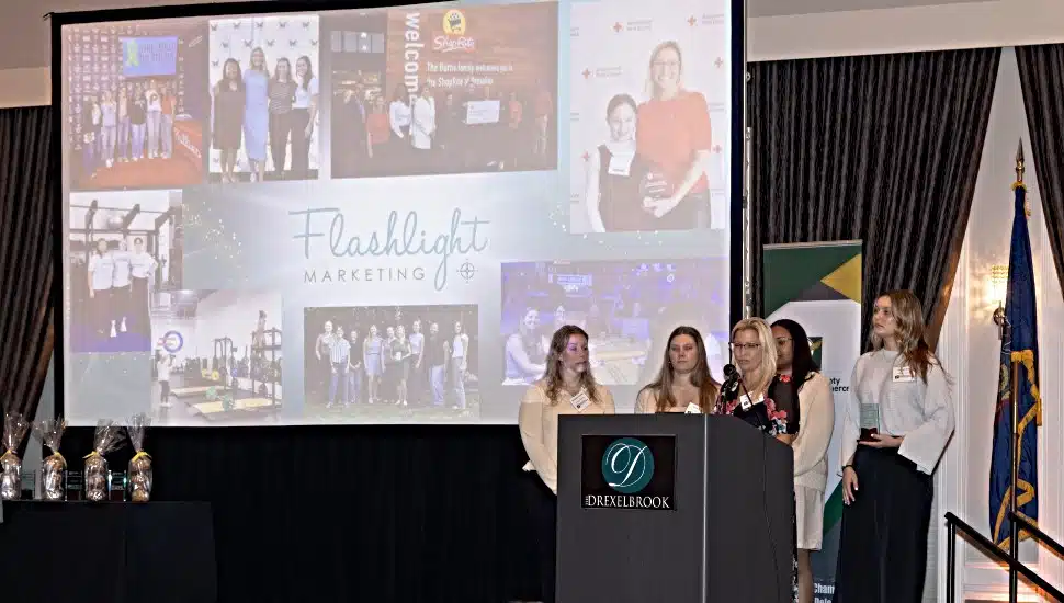 Carly Spross and her team from Flashlight Marketing accept the Women-Owned Business of the Year Award at the Delaware County Small Business Awards breakfast.