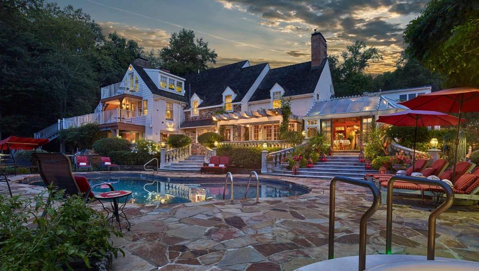 Exterior of the Inn at Bowman's Hill and the inn's pool.