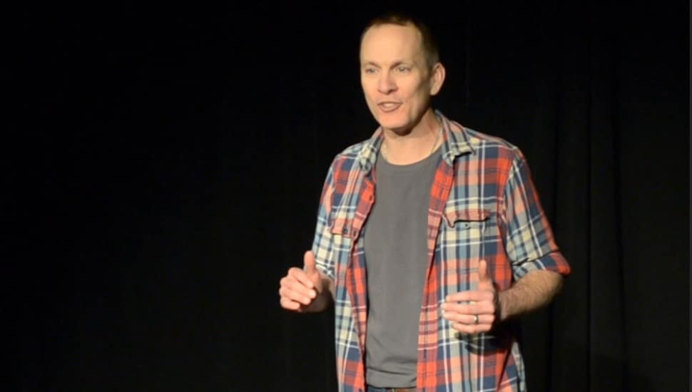 Jay Sefton on stage in his solo performance Unreconciled.