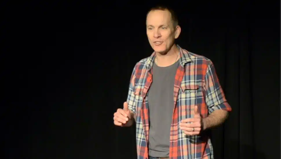 Jay Sefton on stage in his solo performance Unreconciled.