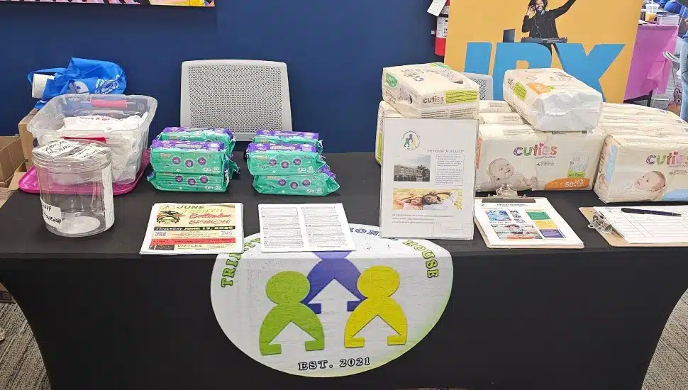 Trinity Transitional House Inc. had a table with some diaper products at the 2025 Keystone Center Block Party & Health Fair in October 2025.